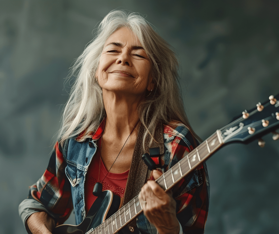 woman playing electric guitar, illustrating the idea of how important it is to get in touch with your creativity
