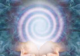 Observe the continuous vortexing spiral of energy flowing in and out A person holding their hands out in front of a spiral.